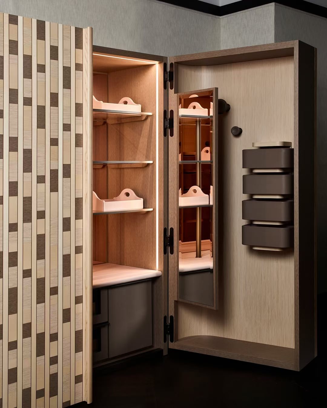 Custom illuminated dressing storage with rotating internal organizers and concealed hardware